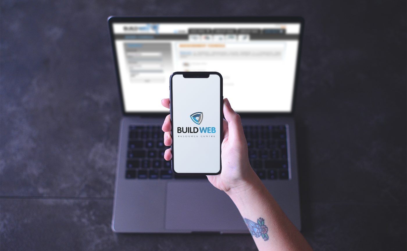 BuildWeb shield mark and wordmark shown on a phone screen and a laptop